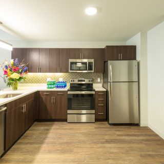 kitchen with stainless steel appliances and flowers in midtown park apartments