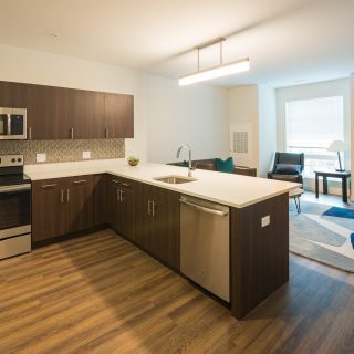 kitchen with stainless steel appliances in residences at midtown park apartments
