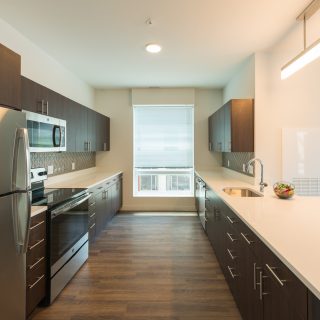 Kitchen with wood cabinets in wilmington, de riverfront apartments