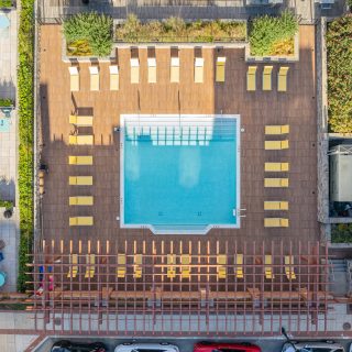 aerial view of outside courtyard with a pool and seating arrangements in Wilmington, DE